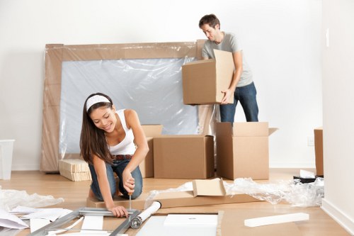 Movers carrying furniture from a flat in Turnpike Lane