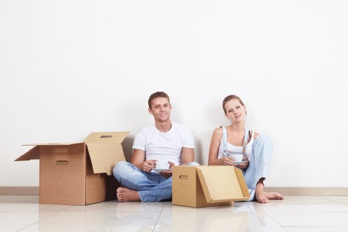 Packed moving boxes and furniture loaded into a removal truck