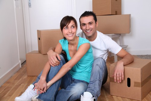 Van movers using protective equipment during loading