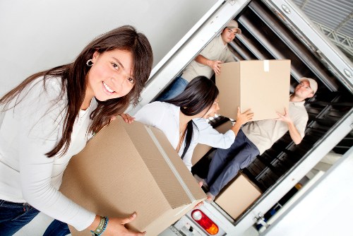 Removal team handling furniture transport near Turnpike Lane