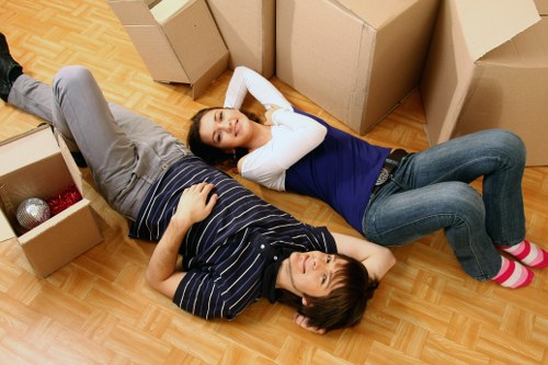 Local movers handling furniture in a flat near Turnpike Lane
